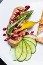 Goose liver foie grass,Duck mousse spread with cranberry sauce & rosemary served on plate.Gourmet dinner dish in Mediterranean Royalty Free Stock Photo