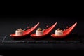 Goose liver pate, foie gras, served on black stone in Japanese red spoons. Paste served with jam and nuts. Fusion food