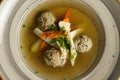 Goose soup, consomme with dumplings and vegetables