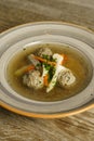 Goose soup, consommÃÂ© with dumplings and vegetables