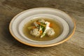 Goose soup, consommÃÂ© with dumplings and vegetables