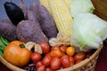 Gooseberries, corn, purple sweet potato, tomatoes and lettuce in basket. vegetable harvest from farm Royalty Free Stock Photo