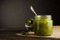 Gooseberry smoothie in a jar on a brown table