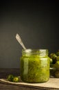 Gooseberry smoothie in a jar on a white table