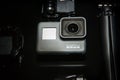 GoPro HERO 5 action camera with tripod closeup Royalty Free Stock Photo