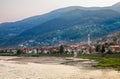 Gorazde residential district town panorama with mosque on the riverbank and Drina river in the foreground, Bosnia and Herzegovina