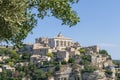 Gordes beautiful old village with pastel buildings on the hill surrounded by mountains in Vaucluse, Provence, France Royalty Free Stock Photo