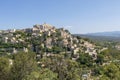 Gordes beautiful old village with pastel buildings on the hill surrounded by mountains in Vaucluse, Provence, France Royalty Free Stock Photo