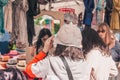 Gordes, Provence-Alpes-Cote d`Azur, France, September 25, 2018: Chinese tourist trying on hat