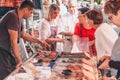 Gordes, Provence-Alpes-Cote d`Azur, France, September 25, 2018: Rush at the counter with meat delicacies and snacks