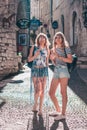 Gordes, Provence-Alpes-Cote d`Azur, France, September 25, 2018: Two attractive cute blonde tourist