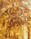 Goreme, Cappadocia, Turkey - 15.12.2021: Frescos and murals in ancient cave church painted in directly onto rock Royalty Free Stock Photo