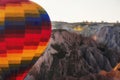 Goreme, Cappadocia, Turkey .   Top view of colorful hot air balloons flying over the Red valley on sunrise Royalty Free Stock Photo