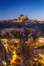 Goreme, Cappadocia, Turkey. View of the evening city from the mountain. Bright evening city. Landscape in the summertime. UNESCO h Royalty Free Stock Photo