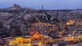 Goreme City at twilight, Famous tourist center of balloon fligths in Cappadocia, Turkiye, Aerial view twilight Goreme City from