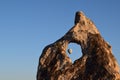 Goreme hot air balloon behind rock