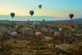 GOREME, TURKEY: Colorful Hot air balloons fly over Cappadocia, Goreme, Central Anatolia, Turkey. Hot-air ballooning is very