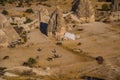 GOREME, TURKEY: Horses grazing in a clearing near the rocks