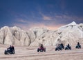 Happy tourists enjoying a quad bike ride in Cappadocia, Turkey Royalty Free Stock Photo