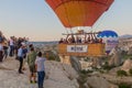 GOREME, TURKEY - JULY 21, 2019: People in a gondola of hot air balloon above Cappadocia landscape, Turk