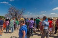 GOREME, TURKEY - JULY 20, 2019: Tourists at an evil eye amulet tree near Goreme town in Cappadocia, Turk