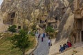 GOREME, TURKEY - JULY 19, 2019: Tourists visit Goreme open air museum in Cappadocia, Turk