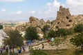 GOREME, TURKEY - JULY 19, 2019: Tourists visit Goreme open air museum in Cappadocia, Turk