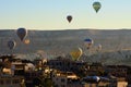 Air balloons festival in Cappadocia. Hot air balloons flying over Goreme city. Royalty Free Stock Photo