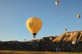 Hot air balloons festival in Cappadocia. Close-up view of yellow balloon against blue sky.