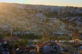 Sunset landscape view of ancient Goreme in Cappadocia. Amazing cave houses in shaped sandstone rocks
