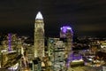 A gorgeous aerial shot of the city skyline at night with skyscrapers and buildings in the cityscape and lights in downtown Charlot