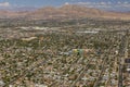 Gorgeous aerial view of Las Vegas with mountain landscape in background.