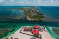 Gorgeous aerial view of the Split in Caye Caulker, Belize with turquoise water under a cloudy sky