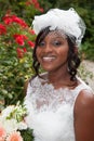 Gorgeous african american bride outside posing and smiling Royalty Free Stock Photo
