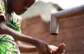 Gorgeous African Black Young Girl Washing Hands Outdoors with Freshwater Royalty Free Stock Photo