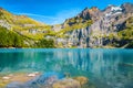 Gorgeous alpine lake with high mountains and glaciers, Oeschinensee, Switzerland