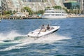 Gorgeous amazing view of people driving motor boat on the lake Ontario at high speed Royalty Free Stock Photo