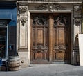 Gorgeous antique double door entrance of baroque architecture style building in Paris France. Vintage wooden doorway. Royalty Free Stock Photo