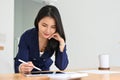 Gorgeous Asian businesswoman or female secretary working at her office desk Royalty Free Stock Photo