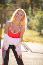 Cheerful sporty woman posing at the playground Royalty Free Stock Photo