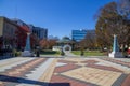 A gorgeous autumn landscape at the Decatur Square with red and yellow autumn trees, lush green trees and a round blue pergola Royalty Free Stock Photo