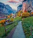 Gorgeous autumn view of great waterfall in Lauterbrunnen village. Splendid outdoor scene in Swiss Alps, Bernese Oberland in the ca