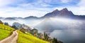 Gorgeous autumn view on suburb of Stansstad city and Lucerne lake with mountaines and fog Royalty Free Stock Photo