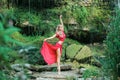 Gorgeous ballerina performing outdoors in the nature