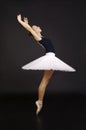 Gorgeous ballerina in a white tutu dancing ballet