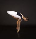 Gorgeous ballerina in a white tutu dancing ballet