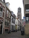 A gorgeous bike-lined cobbled street leading to the Domtoren in Utrecht, The Netherlands Royalty Free Stock Photo