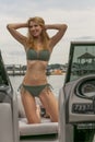 Beautiful Bikini Model Relaxing On A Boat By The Docks Royalty Free Stock Photo