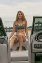 Beautiful Bikini Model Relaxing On A Boat By The Docks Royalty Free Stock Photo