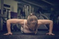 Gorgeous blonde woman warming up and doing some push ups a the gym, Sports concept healthy lifestyle and fitness Royalty Free Stock Photo